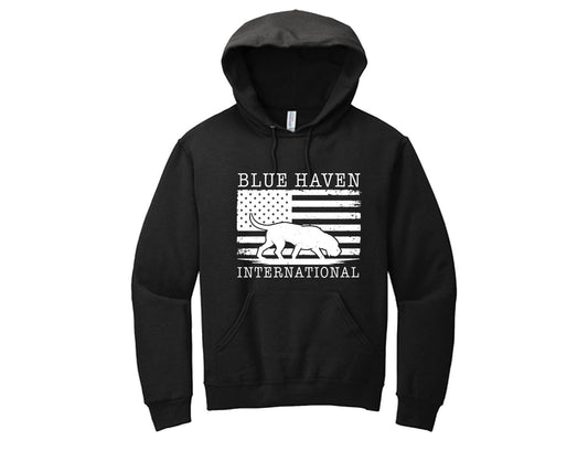 Celebrate pride and purpose with this black hoodie featuring Gerty the bloodhound against a distressed American flag backdrop. Bold yet timeless, this design is perfect for those who believe in Blue Haven International’s mission. Wear it to show your support and stand with a cause that matters.
