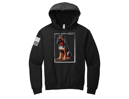 This black hoodie brings K9 Gerty to life with a bold illustration of her in her mission-ready gear. With patriotic flag details on the sleeve, this hoodie combines heart, personality, and purpose—a must-have for supporters of Gerty and the mission she represents at Blue Haven International.

Details:

Unisex fit, available in sizes S–3XL.
Soft, durable cotton/poly blend for comfort.

Wear your support. Stand for the mission. Order now and make a difference!