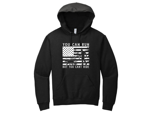 Make a statement with this bold black hoodie featuring K9 Gerty, the bloodhound, and the powerful message: “You Can Run, But You Can’t Hide.” With a distressed American flag background and striking silhouette artwork, this hoodie celebrates justice, loyalty, and the relentless spirit of Blue Haven International.